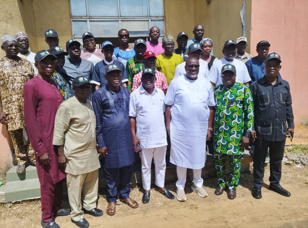 Onuh Edoka in group photograph with Kogi workers during workplace security campaign in Lokoja